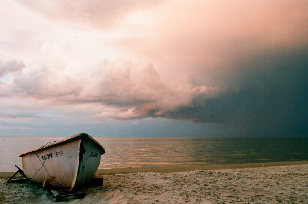 An empty boat on a stranded shore